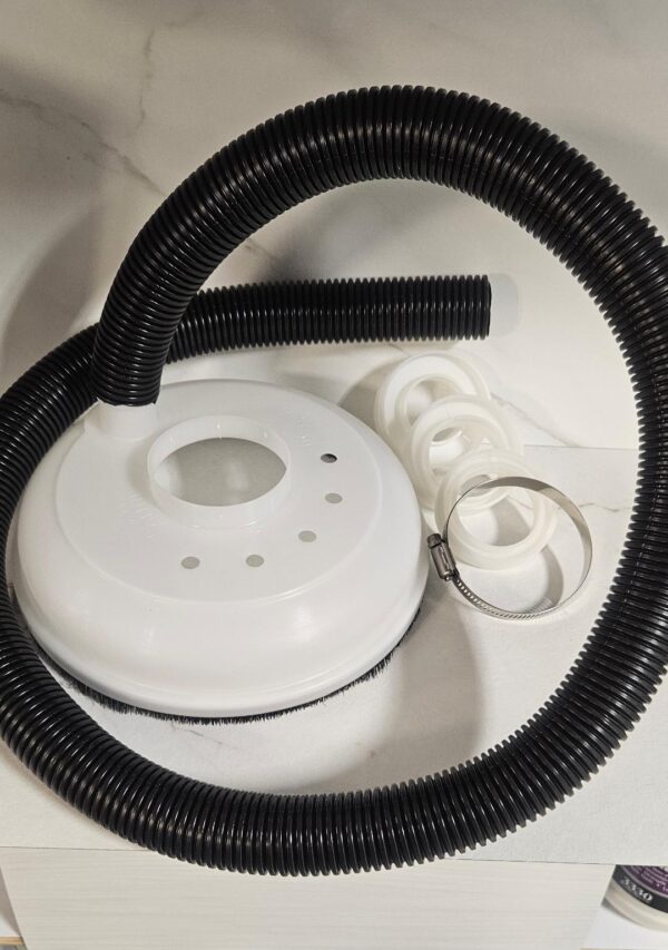 Complete KS100 kit laid out: white dust collector hood, 1.5 inch corrugated vacuum hose, three white adaptor rings and stainless steel clamp